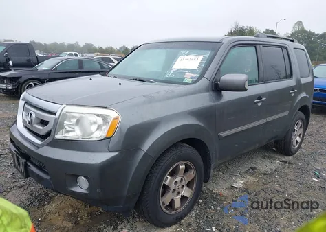 2011 Honda Pilot Touring z USA, uszkodzony, nr VIN 5FNYF4H92BB035672